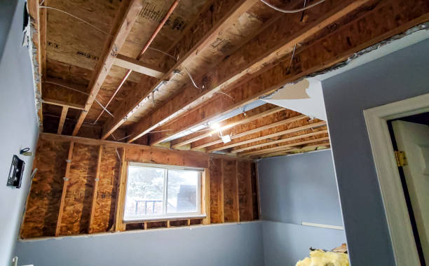 water damaged room with drywall removed to aid in drying of the structure